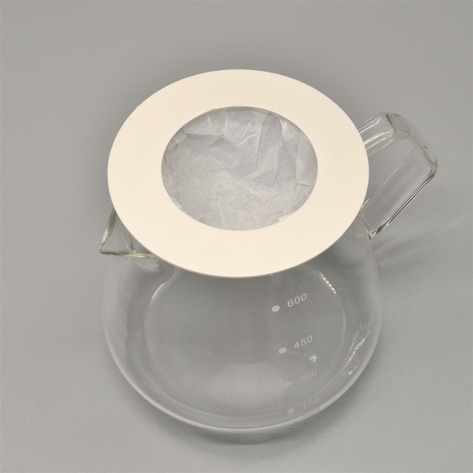 Tonchant Coffee Filters resting on a glass server with the filter pocket open